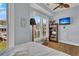 Inviting bedroom with large window, hardwood floors, and media center for comfortable living at 1681 E Ashley Ave # B, Folly Beach, SC 29439