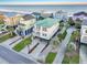 Beautiful two-story beach house with green roof, large balconies, and manicured lawn at 1681 E Ashley Ave # B, Folly Beach, SC 29439
