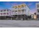Spacious three-story beach house with multiple balconies and dune views at 1681 E Ashley Ave # B, Folly Beach, SC 29439