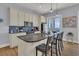 Well-equipped kitchen with seating at the island, stainless appliances, and ocean views at 1681 E Ashley Ave # B, Folly Beach, SC 29439
