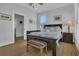 Well-lit bedroom featuring hardwood floors, coastal decor, ceiling fan and neutral-colored walls at 1681 E Ashley Ave # B, Folly Beach, SC 29439