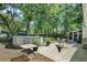 An inviting backyard with patio, pool, and mature trees at 1812 Overrun St, Charleston, SC 29414