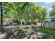 A spacious backyard featuring mature trees and a fenced in yard at 1812 Overrun St, Charleston, SC 29414