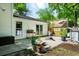 Backyard patio area that features potted plants, lounge chairs and view of detached structure at 1812 Overrun St, Charleston, SC 29414