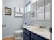 Bathroom featuring modern toilet, sink, mirror and neutral-toned walls at 1812 Overrun St, Charleston, SC 29414