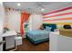 Bright bedroom with colorful striped wall and window view at 1812 Overrun St, Charleston, SC 29414