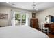 Bright bedroom with a sliding glass door to the backyard patio and light wood floors at 1812 Overrun St, Charleston, SC 29414