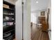 Hallway with closet leading to a room with wood floors and furniture at 1812 Overrun St, Charleston, SC 29414