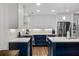Bright kitchen showcasing stainless steel appliances, modern range hood, and white countertops at 1812 Overrun St, Charleston, SC 29414