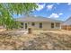 Backyard with patio, lawn, and exterior home details at 1932 Staffwood Rd, Johns Island, SC 29455