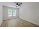 Bedroom featuring a ceiling fan, luxury vinyl plank flooring and a large window with natural light at 1932 Staffwood Rd, Johns Island, SC 29455