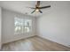 Bedroom with luxury vinyl plank flooring, a ceiling fan, and a large window at 1932 Staffwood Rd, Johns Island, SC 29455