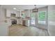 Modern kitchen with stainless steel appliances, white cabinetry, and a spacious layout, perfect for cooking at 1932 Staffwood Rd, Johns Island, SC 29455