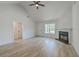Bright living room with a fireplace, modern flooring, and large windows, offering a comfortable at 1932 Staffwood Rd, Johns Island, SC 29455