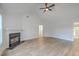 Bright and airy living room featuring a fireplace, vaulted ceilings, and modern flooring for style at 1932 Staffwood Rd, Johns Island, SC 29455