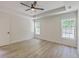 Spacious main bedroom features new floors, tray ceilings, ceiling fan, and bright windows overlooking backyard at 1932 Staffwood Rd, Johns Island, SC 29455