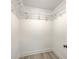 Walk in closet featuring bright white walls, trim, and shelving with new floors at 1932 Staffwood Rd, Johns Island, SC 29455