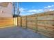 Backyard featuring a stained wood fence, a concrete pad and a side yard with artificial turf at 1956 Beech Ave, North Charleston, SC 29405
