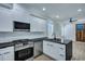 Modern kitchen has stainless steel appliances, dark counters, and white cabinets at 1956 Beech Ave, North Charleston, SC 29405