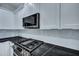Kitchen detail shows new appliances, subway tile backsplash, and gorgeous dark countertops at 1956 Beech Ave, North Charleston, SC 29405