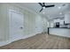 Stylish living area flows seamlessly into a modern kitchen with new appliances and luxury vinyl flooring at 1956 Beech Ave, North Charleston, SC 29405