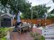 Backyard featuring brick patio, dining area, and ample space for outdoor activities at 2 Live Oak Ave, Charleston, SC 29407