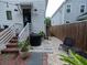 Landscaped backyard features gravel, stone walkway, and stairs to home's entrance at 2 Live Oak Ave, Charleston, SC 29407