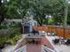 Spacious backyard with brick patio, dining area, and ample space for outdoor activities at 2 Live Oak Ave, Charleston, SC 29407