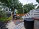 Inviting backyard features a brick patio and gravel, perfect for outdoor gatherings and relaxation at 2 Live Oak Ave, Charleston, SC 29407