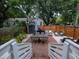 Cozy backyard with brick patio, outdoor seating, and lush landscaping at 2 Live Oak Ave, Charleston, SC 29407