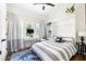 Bedroom with a desk area, built-in cabinets, and large windows for natural light at 2 Live Oak Ave, Charleston, SC 29407