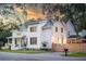 Charming two-story home with a covered front porch and well-maintained landscaping at 2 Live Oak Ave, Charleston, SC 29407