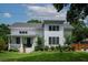 Charming two-story modern farmhouse with a manicured lawn and welcoming front porch at 2 Live Oak Ave, Charleston, SC 29407