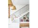 Bright kitchen with undermount sink, gold faucet, and under stair shelving at 2 Live Oak Ave, Charleston, SC 29407