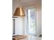 Bright kitchen with white cabinets, stone countertops, and a large window at 2 Live Oak Ave, Charleston, SC 29407