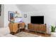 Open concept living room with built-in shelving, modern lighting, and hardwood flooring at 2 Live Oak Ave, Charleston, SC 29407