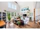 Bright living room featuring hardwood floors, vaulted ceilings, and a large window for natural light at 2 Live Oak Ave, Charleston, SC 29407