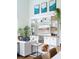 Cozy living room with built-in shelving, a comfortable sofa, and a relaxed pet at 2 Live Oak Ave, Charleston, SC 29407