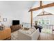 Bright loft features hardwood floors, exposed wood beams, and comfortable seating area at 2 Live Oak Ave, Charleston, SC 29407