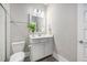 Clean bathroom featuring a white vanity, toilet, wood look flooring, and tiled shower at 200 Clearblue Loop, Summerville, SC 29486
