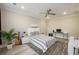 Well-lit bedroom with guitar, desk, and plant accents, complemented by neutral walls and carpet at 200 Clearblue Loop, Summerville, SC 29486