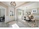 Bright dining area features a modern light fixture, a geometric rug, and a light-filled entryway at 200 Clearblue Loop, Summerville, SC 29486