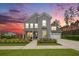 Stunning two-story home with gray siding, white trim under a beautiful sunset at 200 Clearblue Loop, Summerville, SC 29486