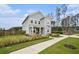 Beautiful two-story home featuring a charming front porch and landscaped front yard with a sidewalk at 200 Clearblue Loop, Summerville, SC 29486
