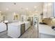 Bright kitchen with white cabinets, stainless steel appliances, large island, and open to living area at 200 Clearblue Loop, Summerville, SC 29486