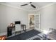 This office features a ceiling fan, desk, and doorway to another room, creating a bright and functional workspace at 200 Clearblue Loop, Summerville, SC 29486