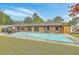 Large backyard with a covered pool and exterior of the house at 201 Hunt Club Dr, Summerville, SC 29485