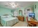 Well-lit bedroom featuring a desk, bed, and dresser with mirror at 201 Hunt Club Dr, Summerville, SC 29485