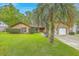 Charming single-story home with lush lawn and mature palm trees at 201 Hunt Club Dr, Summerville, SC 29485