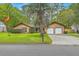Traditional home featuring a well-manicured lawn and a two-car garage at 201 Hunt Club Dr, Summerville, SC 29485